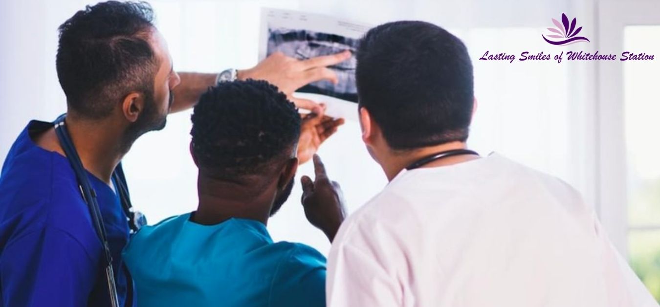 Dentists looking at a patients x-rays.
